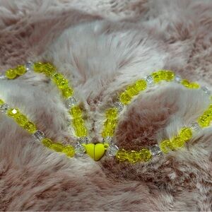 Yellow and Clear bracelets with magnetic Heart shaped Pendant